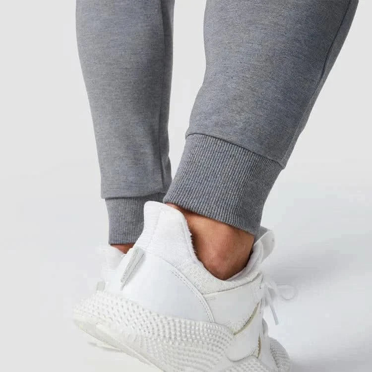 Joggingbuxur - karlar - herra - íþróttaföt - íþróttafatnaður - æfingaföt - æfingafatnaður - ræktarföt - ræktarfatnaður - world - class - SQUATWOLF - íþróttavöruverslun - Ludus.is - gráar - grey