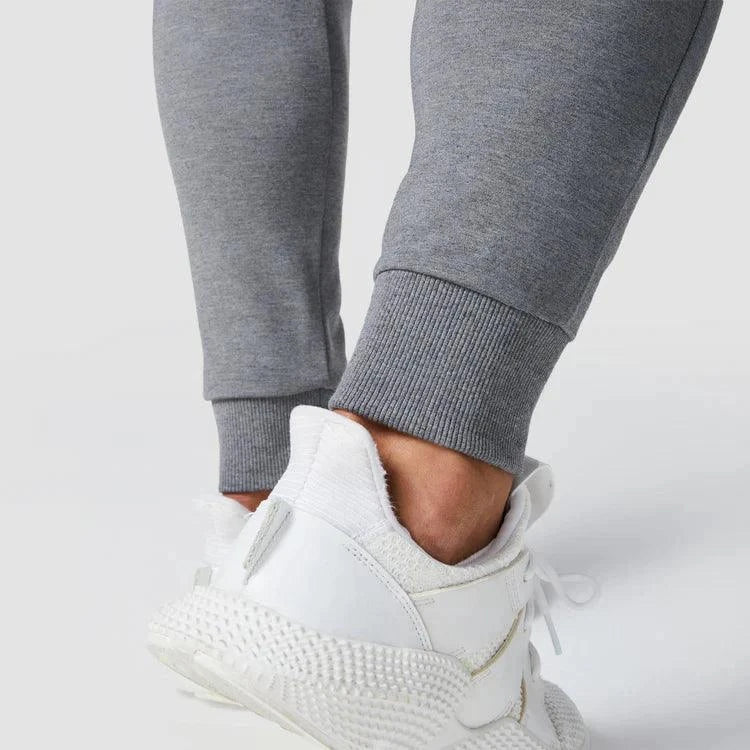 Joggingbuxur - karlar - herra - íþróttaföt - íþróttafatnaður - æfingaföt - æfingafatnaður - ræktarföt - ræktarfatnaður - world - class - SQUATWOLF - íþróttavöruverslun - Ludus.is - gráar - grey