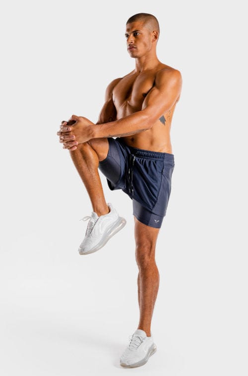 Íþróttaföt frá Squat Wolf í vefverslun Ludus.is. Æfingafatnaður - Hybrid 2 in 1 shorts eru flottar stuttbuxur fyrir herra. Þessar bláu stuttbuxur henta jafnt í Crossfit sem hlaup. #litur-color_navy