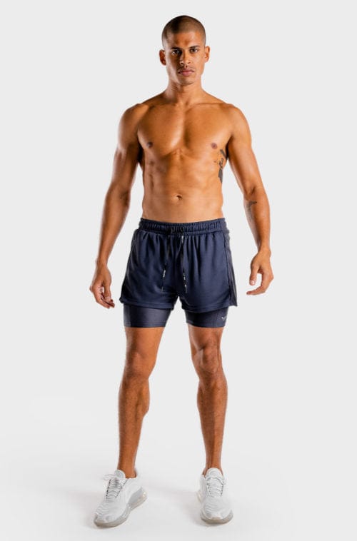 Íþróttaföt frá Squat Wolf í vefverslun Ludus.is. Æfingafatnaður - Hybrid 2 in 1 shorts eru flottar stuttbuxur fyrir herra. Þessar bláu stuttbuxur henta jafnt í Crossfit sem hlaup. #litur-color_navy