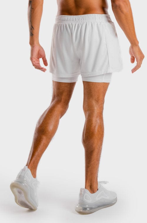 Íþróttaföt frá Squat Wolf í vefverslun Ludus.is. Æfingafatnaður - Hybrid 2 in 1 shorts eru flottar stuttbuxur fyrir herra. Þessar hvítu stuttbuxur henta jafnt í Crossfit sem hlaup. #litur-color_white