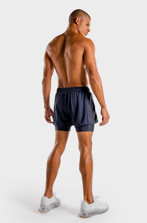 Íþróttaföt frá Squat Wolf í vefverslun Ludus.is. Æfingafatnaður - Hybrid 2 in 1 shorts eru flottar stuttbuxur fyrir herra. Þessar bláu stuttbuxur henta jafnt í Crossfit sem hlaup. #litur-color_navy
