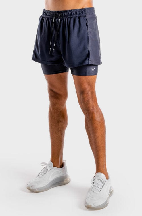 Íþróttaföt frá Squat Wolf í vefverslun Ludus.is. Æfingafatnaður - Hybrid 2 in 1 shorts eru flottar stuttbuxur fyrir herra. Þessar bláu stuttbuxur henta jafnt í Crossfit sem hlaup. #litur-color_navy